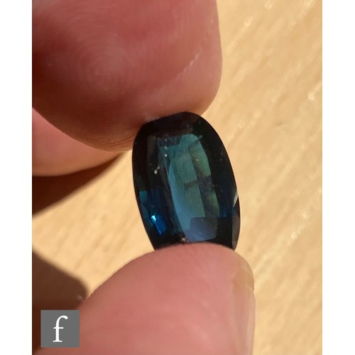 102 - A loose cut and polished oval mixed cut natural indicolite tourmaline stone, length 13.82mm, width 9... 