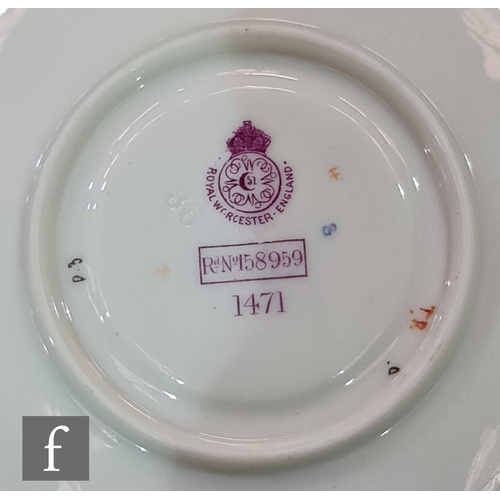 15 - A Royal Worcester shape 1471 Empress blush ivory teacup and saucer decorated with sprays of flowers ... 