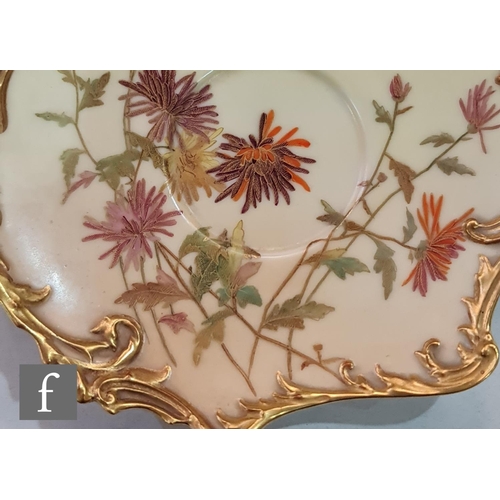 15 - A Royal Worcester shape 1471 Empress blush ivory teacup and saucer decorated with sprays of flowers ... 