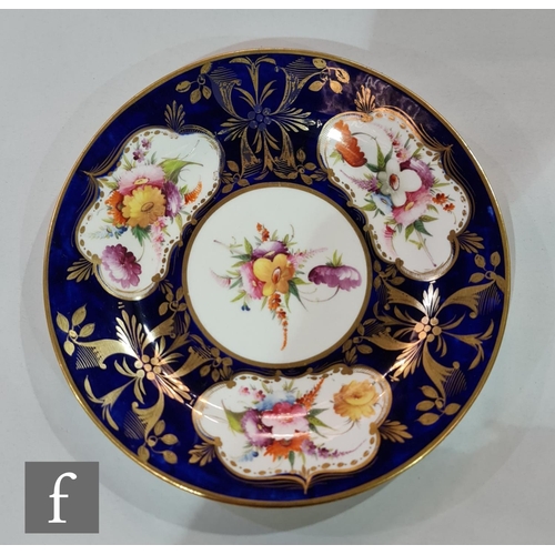 185 - A 19th Century shell shaped dish decorated to the centre with two stylised garden birds amidst a mou... 