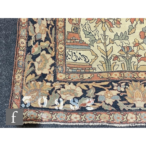 1281 - An early 20th Century Persian 'Tree of Life' pattern rug, on an oatmeal ground within foliate patter... 