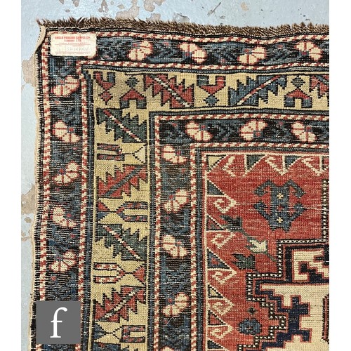 1279 - A Shirvan flat woven rug of deep blue, rust and oatmeal ground colours, with triple medallions to th... 