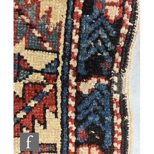 1279 - A Shirvan flat woven rug of deep blue, rust and oatmeal ground colours, with triple medallions to th... 