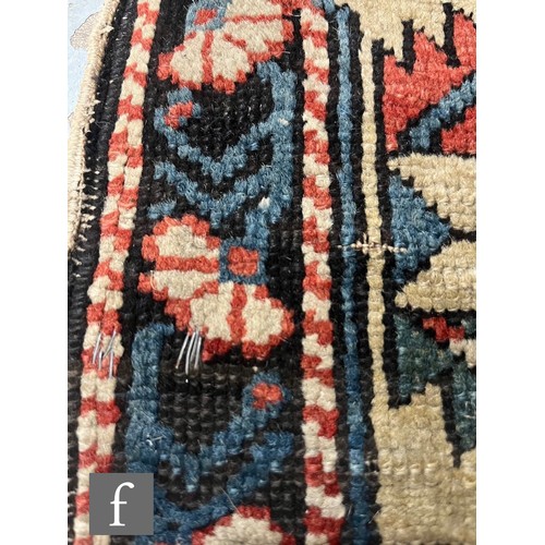1279 - A Shirvan flat woven rug of deep blue, rust and oatmeal ground colours, with triple medallions to th... 