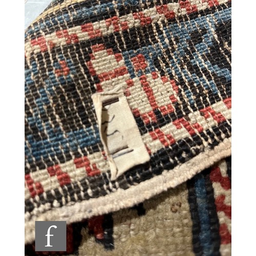 1279 - A Shirvan flat woven rug of deep blue, rust and oatmeal ground colours, with triple medallions to th... 