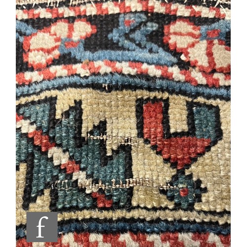 1279 - A Shirvan flat woven rug of deep blue, rust and oatmeal ground colours, with triple medallions to th... 