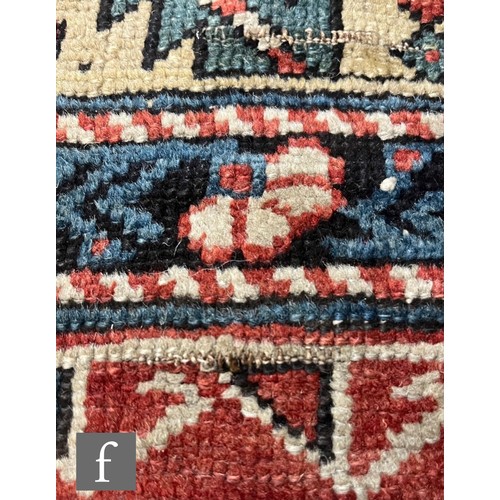 1279 - A Shirvan flat woven rug of deep blue, rust and oatmeal ground colours, with triple medallions to th... 