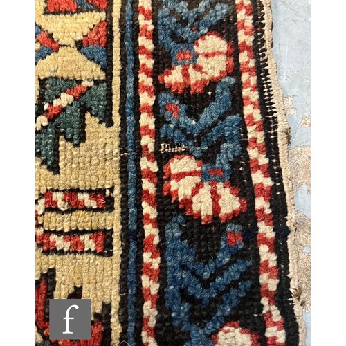 1279 - A Shirvan flat woven rug of deep blue, rust and oatmeal ground colours, with triple medallions to th... 