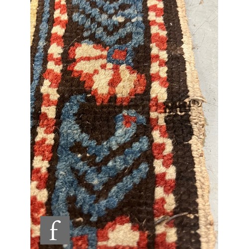 1279 - A Shirvan flat woven rug of deep blue, rust and oatmeal ground colours, with triple medallions to th... 