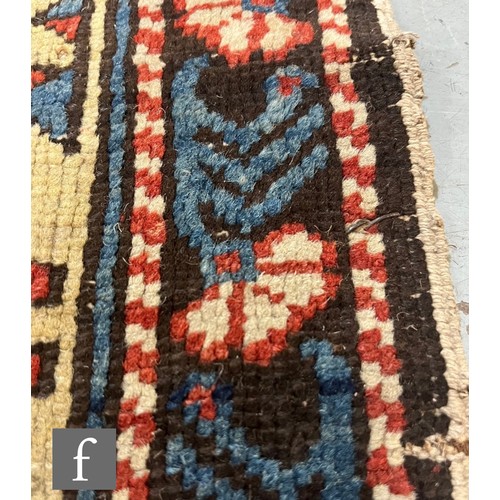 1279 - A Shirvan flat woven rug of deep blue, rust and oatmeal ground colours, with triple medallions to th... 