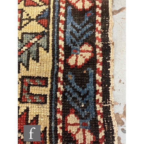1279 - A Shirvan flat woven rug of deep blue, rust and oatmeal ground colours, with triple medallions to th... 