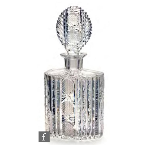 8004 - A post war Czechoslovakian glass decanter, circa 1950, of oval section, cut with prisms, diamonds an... 