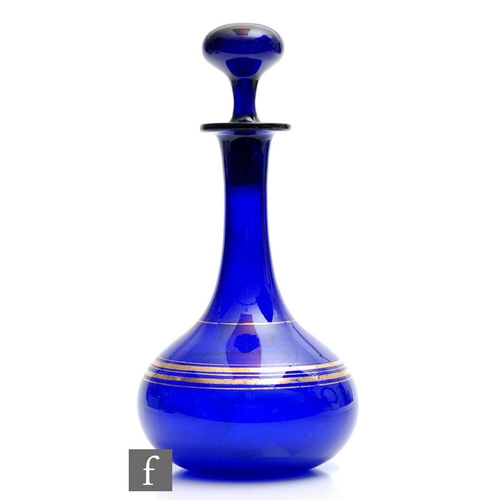 8011 - A 19th Century French glass decanter, circa 1860, of squat globe and shaft form, the cobalt blue bod... 