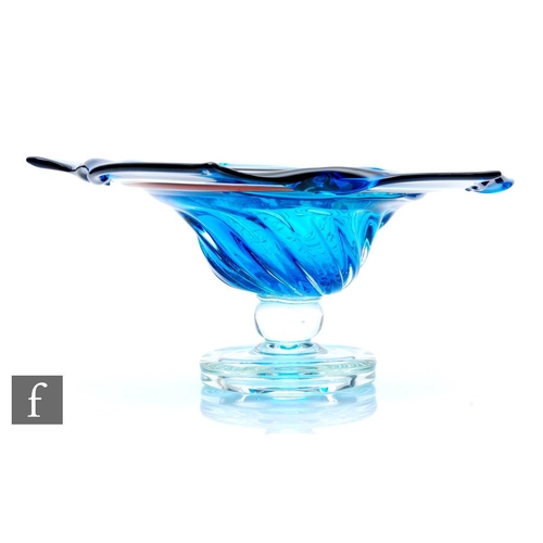 623 - A large contemporary studio glass pedestal bowl, the upper bowl in blue, clear crystal and red with ... 