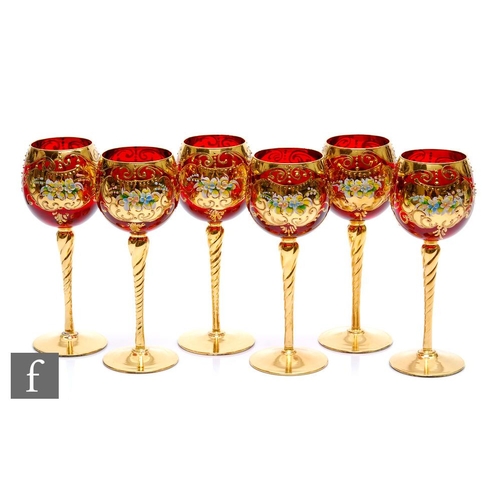 646 - A set of six Bohemian wine glasses, the ovoid bowl decorated with relief enamel floral decoration wi... 