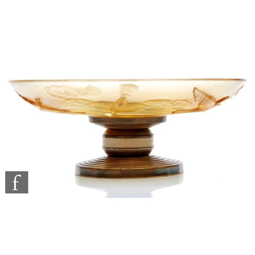 670 - A 1930s French Art Deco pressed glass bowl of shallow circular section, relief molded with birds in ... 