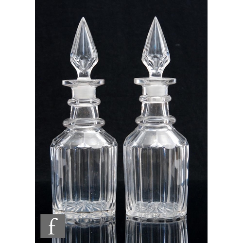 689 - A pair of early Victorian Bludgeon shape decanters each with pillar cut body and slice cut shoulder ... 