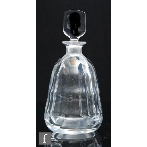 8032 - A post war Orrefors glass decanter of ovoid form with four moulded flat sides, designed by Edward Ha... 