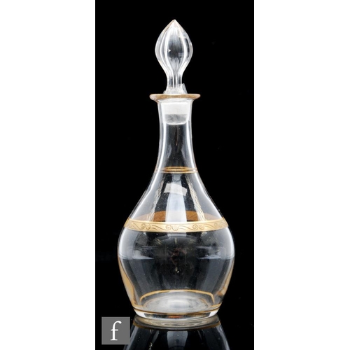 8066 - A Bohemian glass liqueur decanter, circa 1900, of baluster form, the body with a gilded band decorat... 