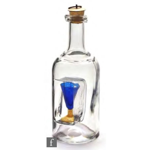8067 - A later 20th century Kjell Engman for Kosta Boda decanter, circa 1982, of bottle form with a coffin ... 