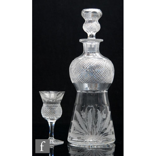 8099 - A 20th Century Scottish glass decanter of thistle form, the lower body engraved with thistles below ... 