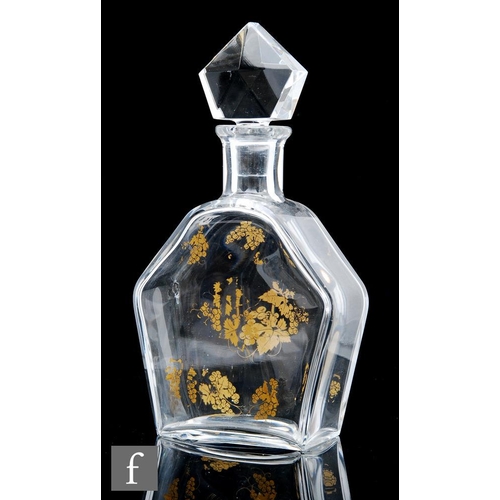 8100 - A Baccarat glass decanter, the hexagonal flat section body with gilded decoration of leaves and berr... 