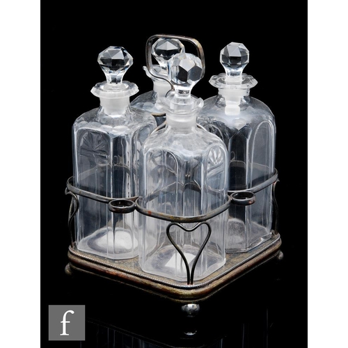 8126 - A set of 18th Century glass spirit decanters, circa 1790-95, in a Sheffield plated frame with centra... 