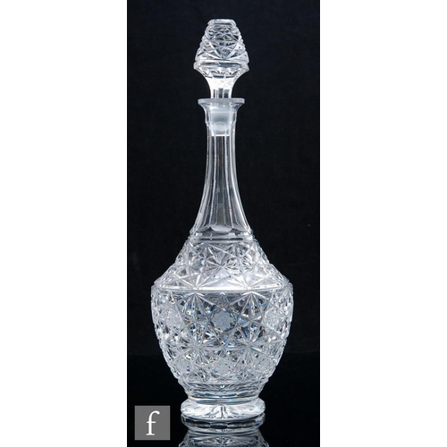 8132 - A 1950s Czechoslovakian crystal baluster form decanter, the body and matching stopper profusely cut ... 