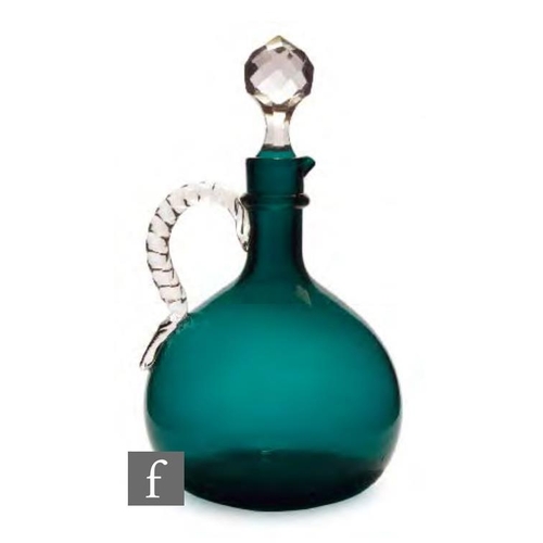 8062 - A 19th Century glass flagon decanter, circa 1860, in deep green with an applied neck ring and a clea... 