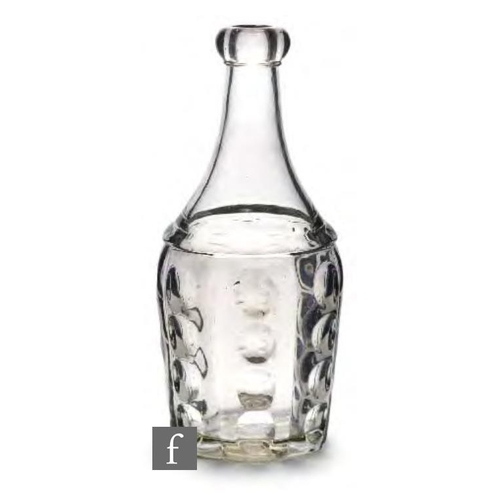 8081 - A 19th Century American glass bar lip decanter, circa 1860, of bottled form, moulded with repeat ver... 