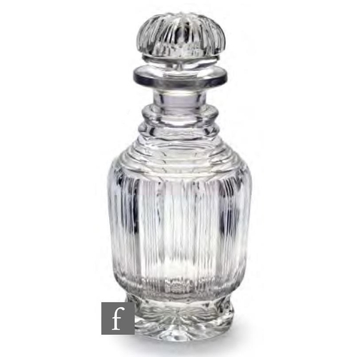 8091 - A 19th Century glass spirit decanter, circa 1830-1835, of footed cylindrical form, cut with vertical... 