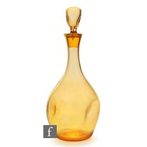 8119 - A Geoffrey Baxter for Whitefriars 9383 decanter in amber, height 29cm.