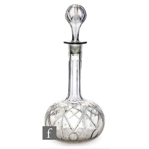 8120 - A mid 19th Century three part mould blown decanter of globe and shaft form with diamond shaped groov... 
