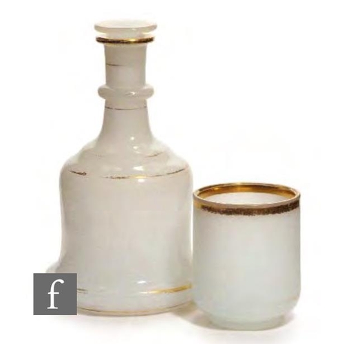 8135 - A 19th Century Bohmeian alabaster glass toilet set, circa 1845, comprising a waisted decanter decora... 
