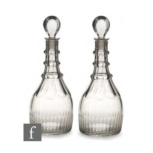 8151 - A pair of late 18th Century glass decanters, circa 1775-1780, each of taper form, with three applied... 