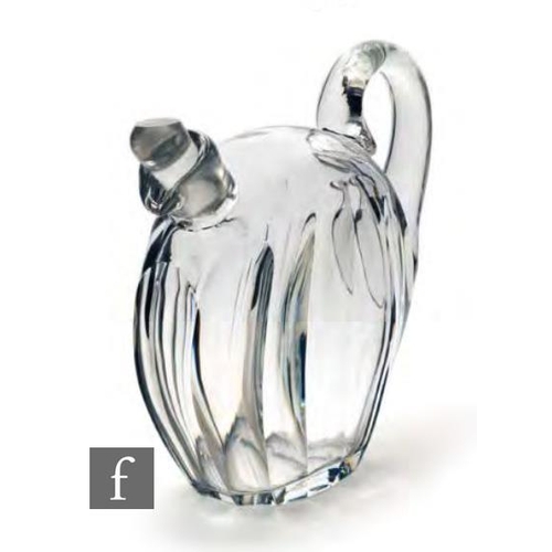 8152 - A 1930s Czechoslovakian glass decanter of compressed ovoid form with slice cut decoration and applie... 