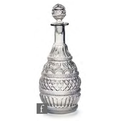 8188 - A late 19th Century French glass bludgeon decanter, circa 1880, three part moulded with bands of dia... 