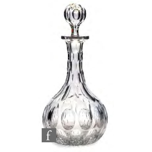 8191 - A 19th Century glass globe and shaft decanter, circa 1845-1860, the body cut with ovals, hexagonal f... 