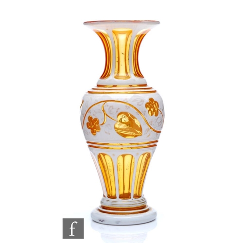 693 - A late 19th Century Bohemian glass vase of shouldered ovoid form with everted neck, cased in opal ov... 