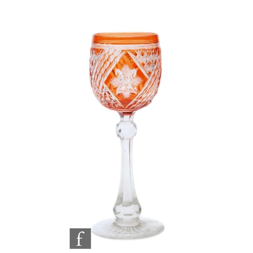 697 - An early 20th Century Stevens & Williams drinking glass, the ovoid bowl cased in a deep peach ov... 