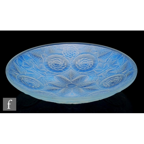 720 - A 1930s French opalescent glass bowl of shallow circular section, relief decorated to the exterior w... 