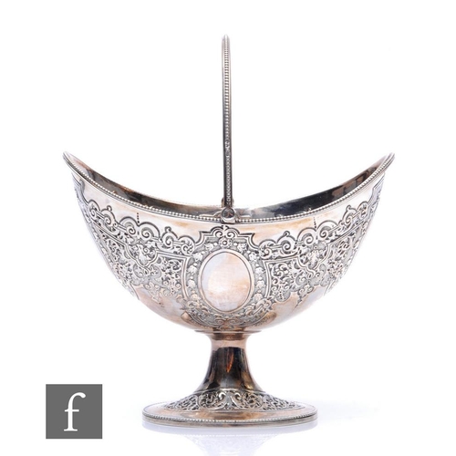 277 - A Victorian hallmarked silver boat shaped pedestal sugar basin with foliate embossed decoration with... 