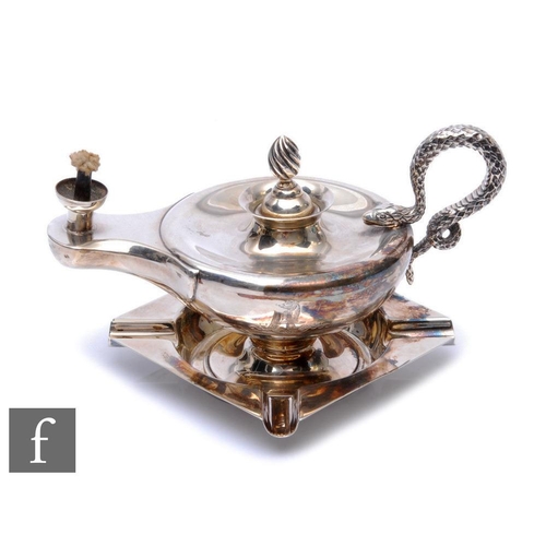 279 - A hallmarked silver table lighter modelled as an Aladdin's lamp terminating in coiled snake handle, ... 