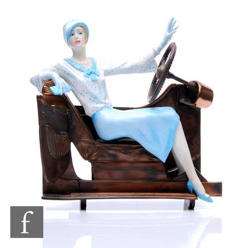 508 - An Albany Fine China lady in the Art Deco style, dressed in blue and sat in a cross section of a mot... 