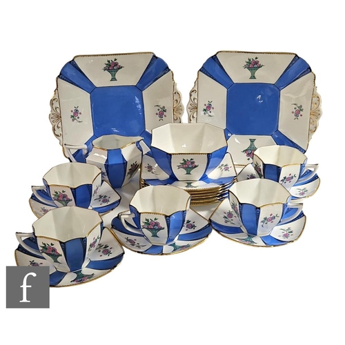 510 - A late 1920s Shelley part teaset decorated in the Panel of Flowers 11525 pattern, comprising two cak... 