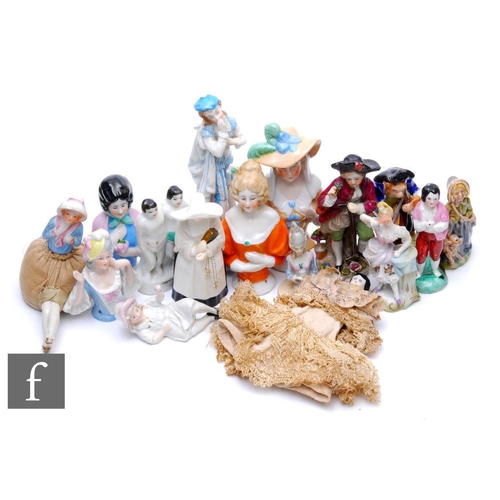 537 - A collection of porcelain half dolls, candle snuffers and figures, to include a Royal Worcester Cand... 