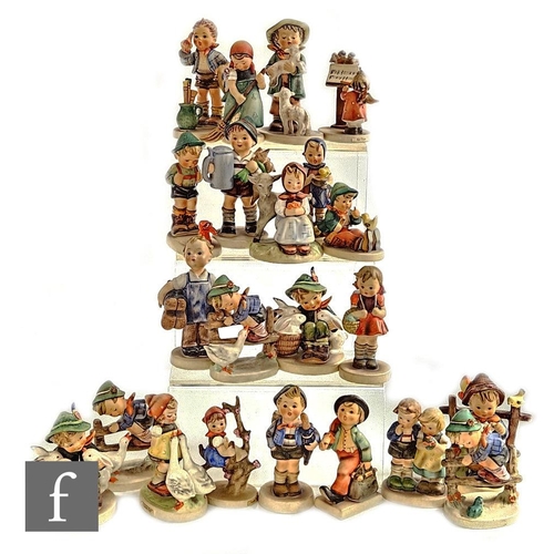 542 - A collection of twenty-three Goebel Hummel figures, including Apple Tree Girl, Goose Girl, Merry Wan... 