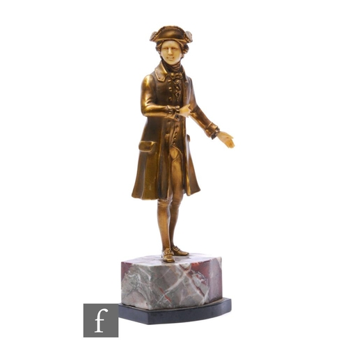 355 - An Art Deco style gilt bronzed model of a gentleman in Regency dress with a tricorn hat, on veined m... 