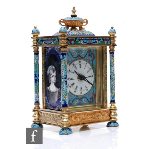 369 - A late 20th Century French style champ leve enamel carriage clock, surmounted with an urn and oval p... 