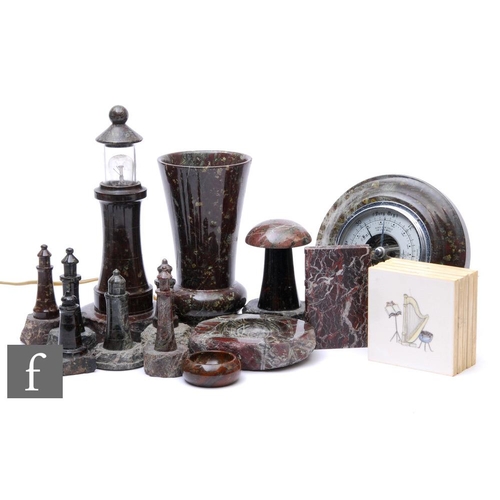 379 - A collection of 20th Century serpentine ware to include light house models, one converted to electri... 